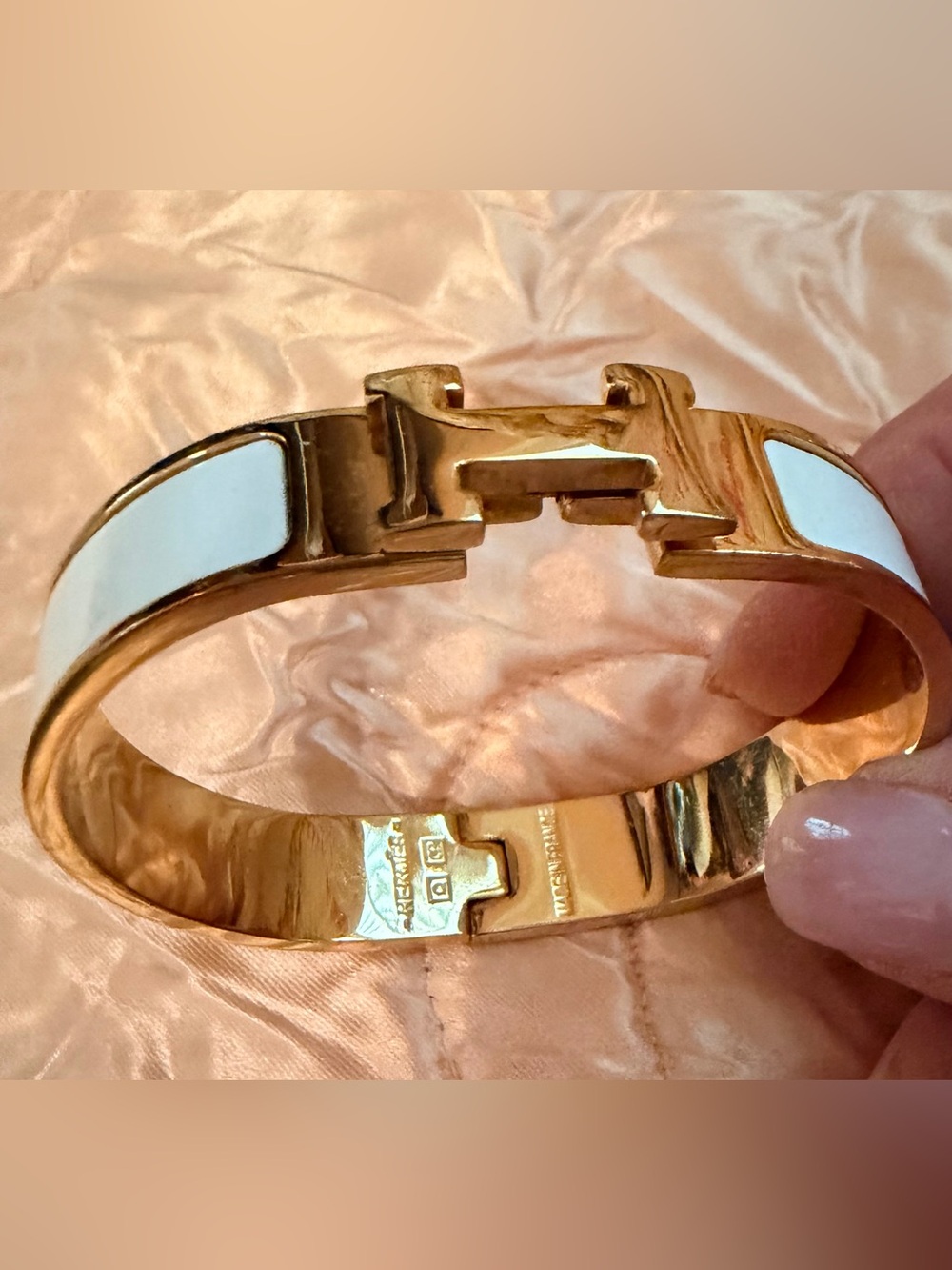 Gold-tone H Bangle Bracelet with White Enamel and Hinged Closure